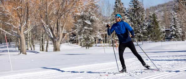 A cross-country skier skate skiing on the Nordic track in Park City, UT