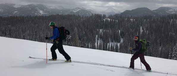 Two skiers skinning in the Uinta Mountains backcountry