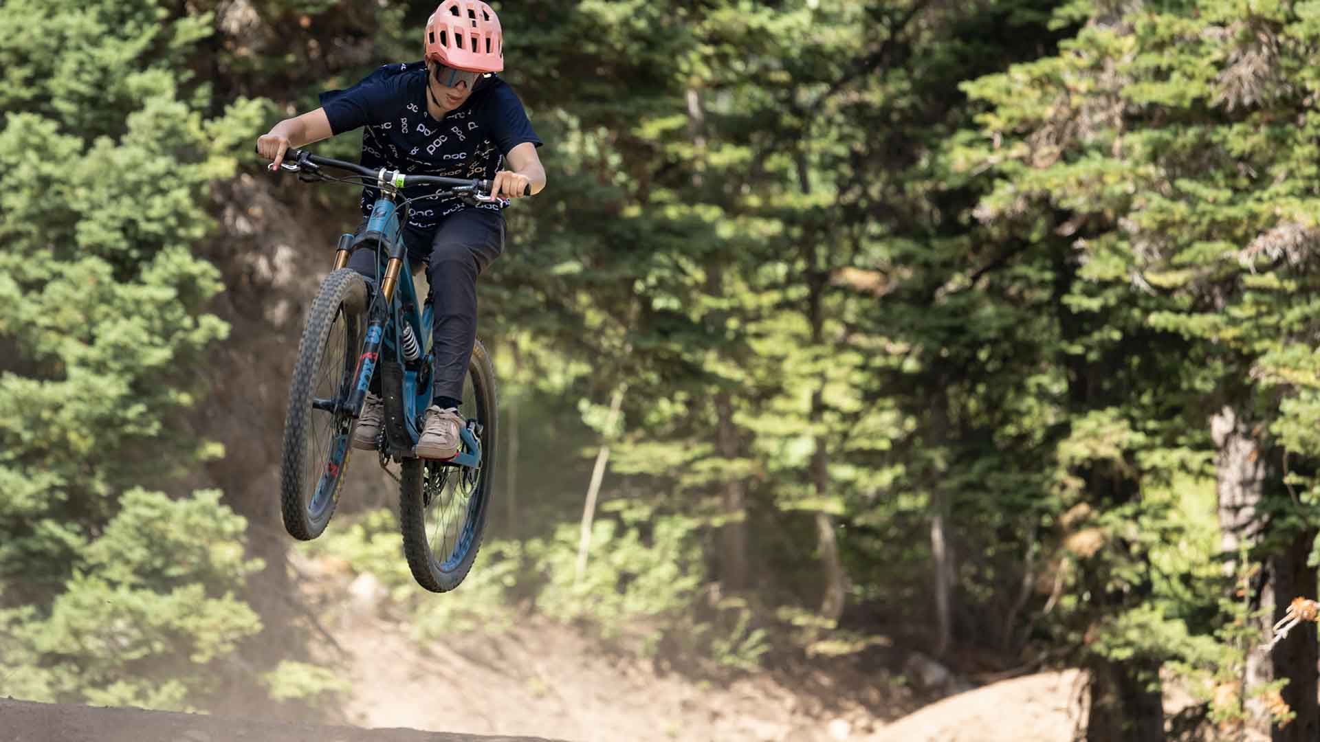 White Pine Touring Guide showing how to air off a jump on a women's mountain bike clinic in Park City, UT.