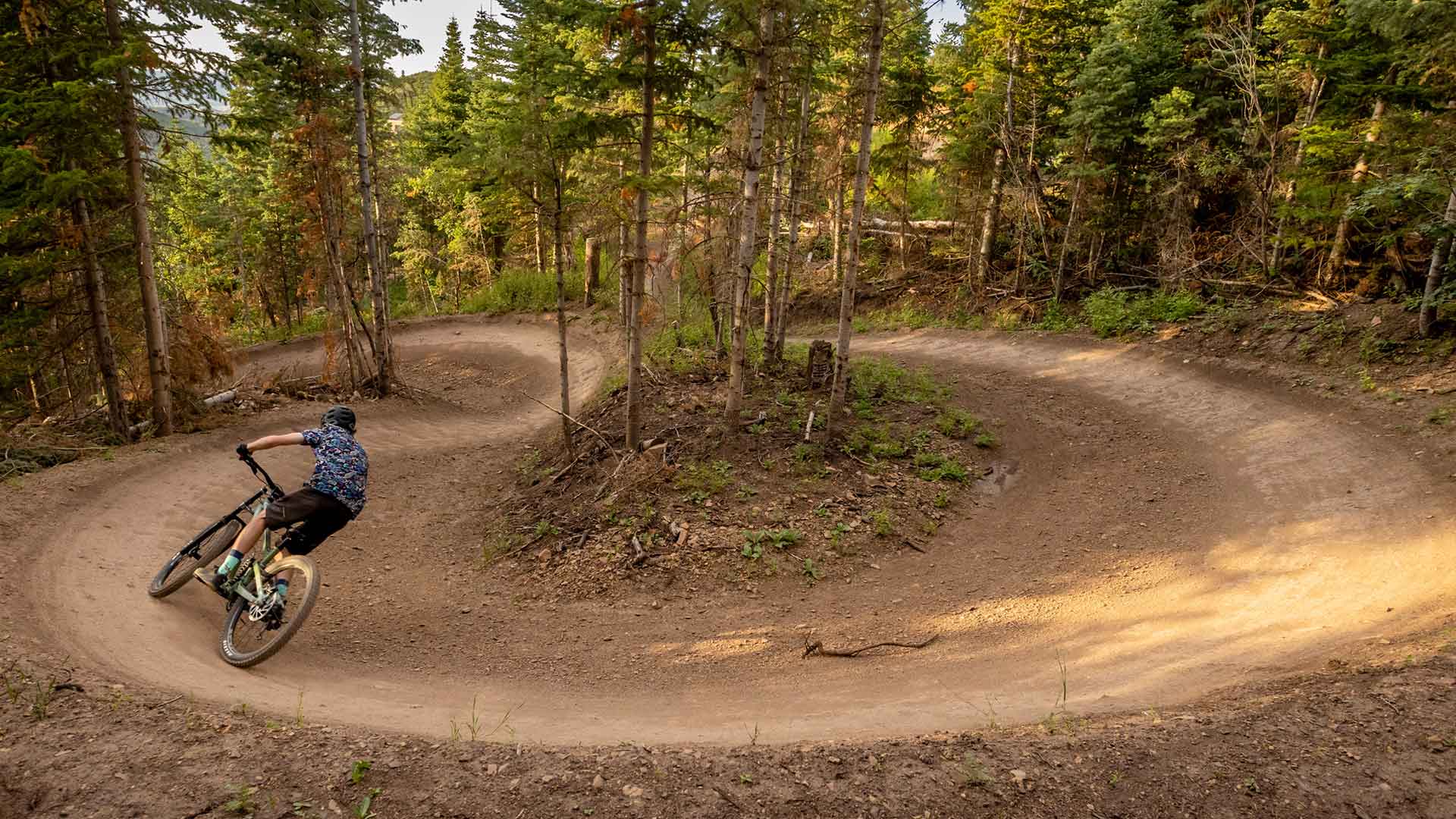 White Pine Touring instructor shows how to coner during a mountain bike clinic in Park City, UT.