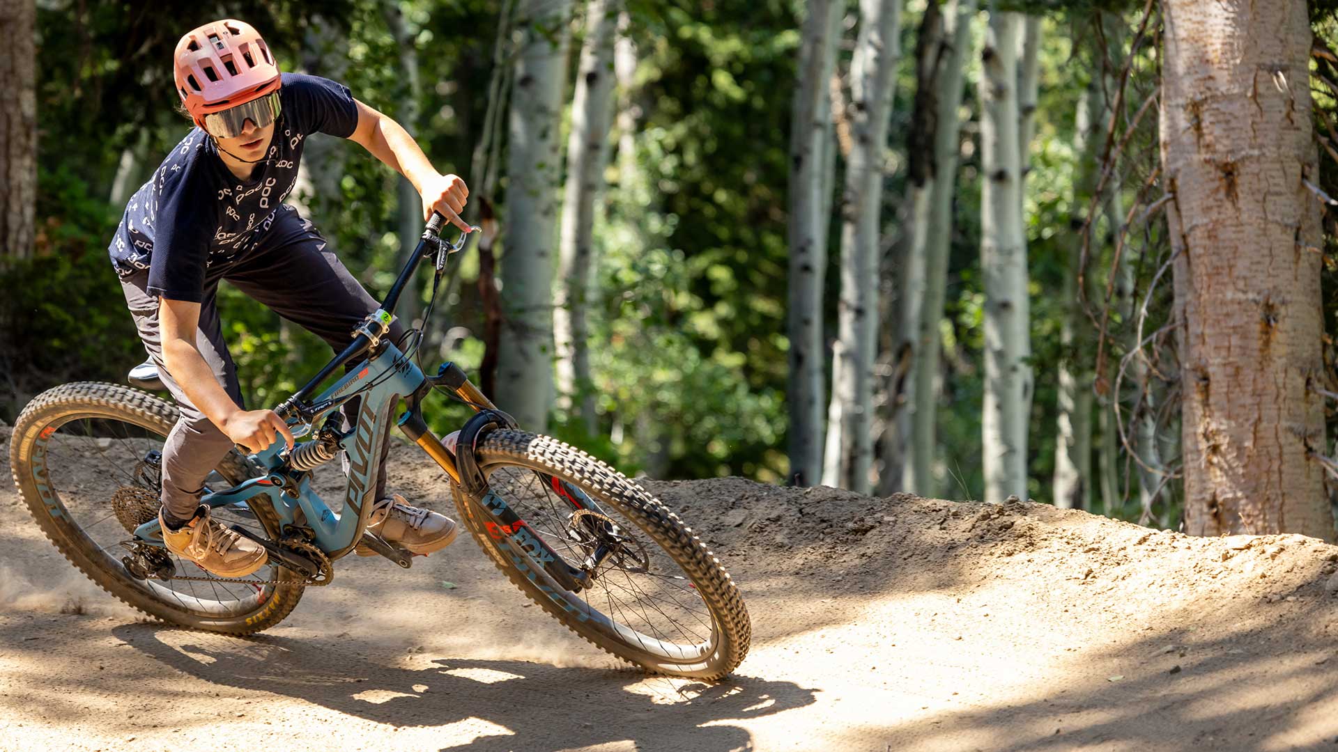 White Pine Touring instructor shows how to coner during a women's only mountain bike clinic in Park City, UT.