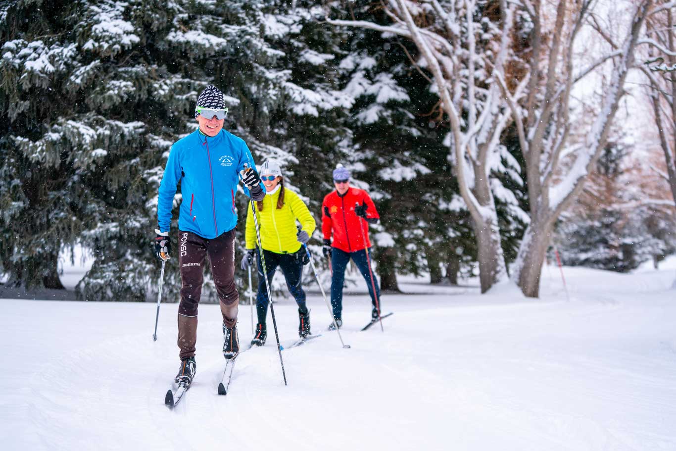 Three classic Nordic skiers on the White Pine Nordic track in Park City, UT.